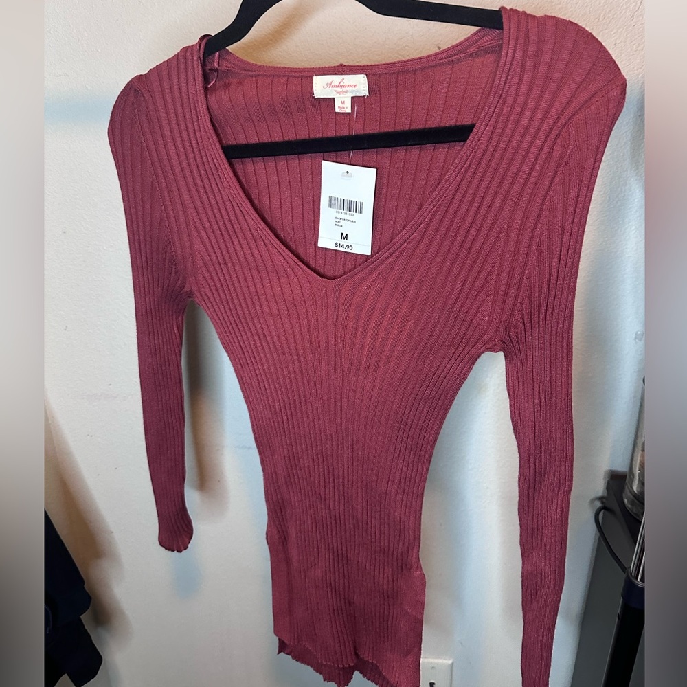 Long tight sweater never been worn tags still on.